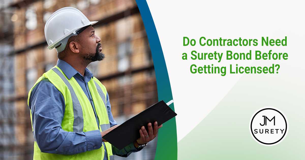 Contractor reviewing construction plans on a job site before obtaining a surety bond for contractor licensing requirements.